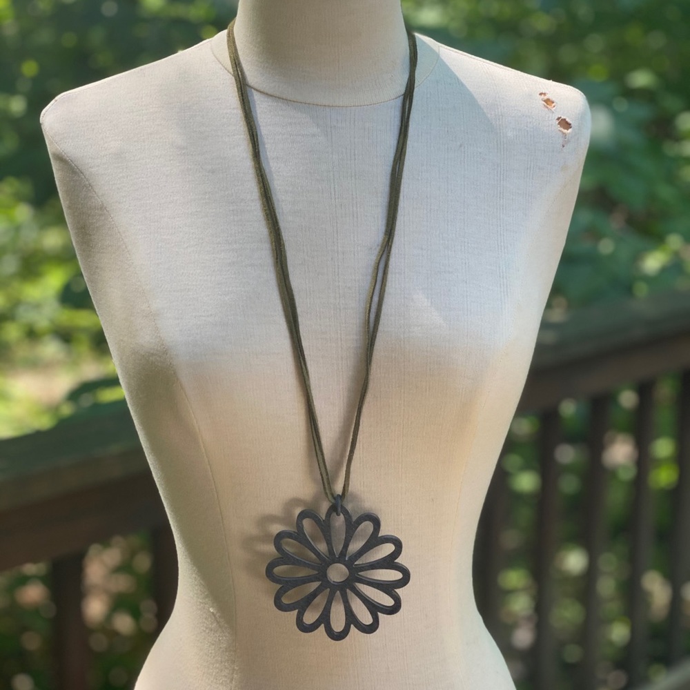 Flower pendant made from Horn on a leather necklace
